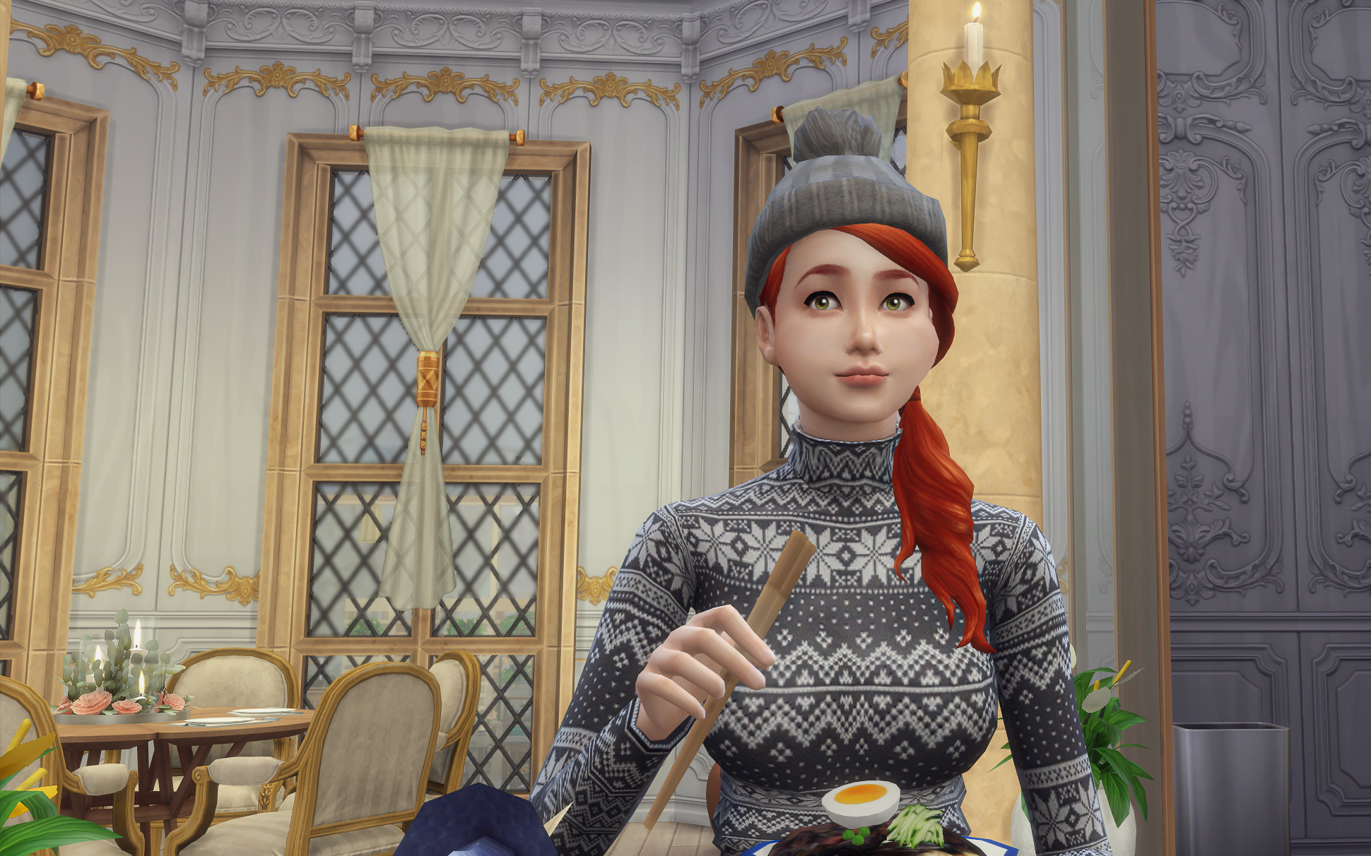 Adelise calmly watches while eating her own food. 